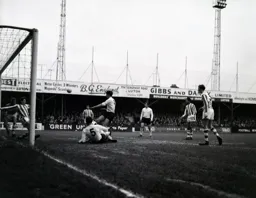 Terry Branston and Alan Slough watch as another chance is cleared off the line