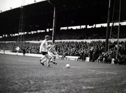 Brian Lewis goes out wide to win the ball