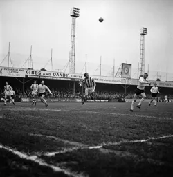 Brian Lewis heads for goal