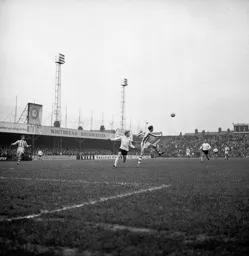 The ball is cleared by the Ware defence