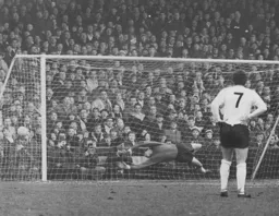 Sandy Davie is beaten from the spot for the only goal of the game