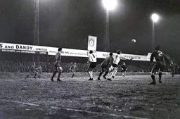 The ball is played in towards Keith Allen