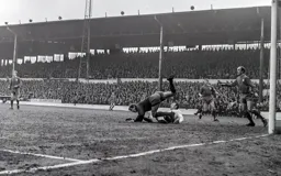 Orient keeper Ray Goddard lands on top of Laurie Sheffield