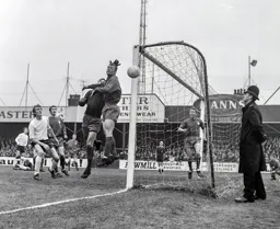 Keith Allen watches the ball just drift wide of the post