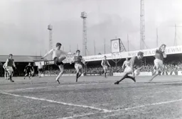 Alan Slough`s shot is blocked by Brighton keeper Brian Powney but Slough scores from the rebound