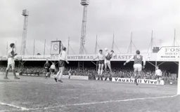 Mike Keen gets the better of John Napier and heads the ball goalwards