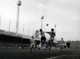 Keith Allen and Dixie Hale wrestle for a high ball