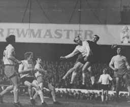 Ian Buxton, in his final game for the club, puts pressure on the Watford defence
