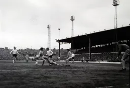 Brian Lewis lays the ball off to Ian Buxton