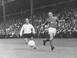 Laurie Sheffield watches the ball passed back to the goalkeeper