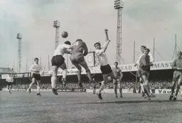 Mike Keen in the centre cannot get his head to the ball