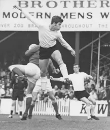 Malcolm Macdonald is beaten to the ball