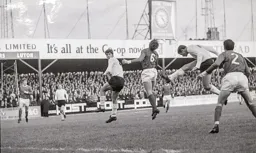 Mike Harrison tries to get his head to the ball