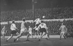 Malcolm Macdonald gets his head to the ball