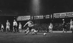 Malcolm Macdonald turns his defender and makes for goal