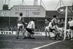 Chris Nicholl grapples on the floor