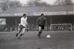 Graham French leaves the Bury defender behind