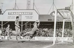 Matt Tees sees the keeper taking the ball as he falls