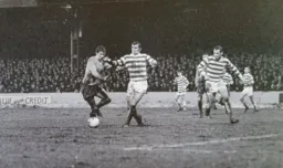 Alan Slough dribbles past his marker