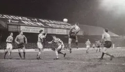 Malcolm Macdonald heads across goal