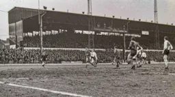 John Collins gets his boot to the ball first