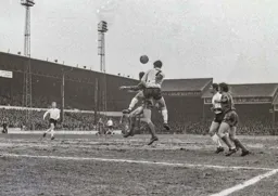 Malcolm Macdonald gets his head to the ball