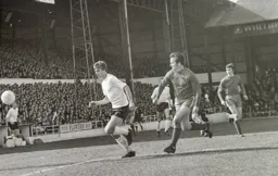 Viv Busby races on to a through ball