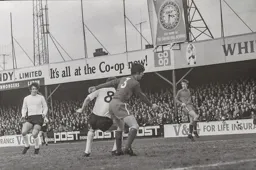 Graham French watches on as Keith Allen battles with a defender