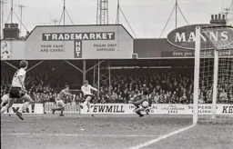 Mike Harrison scores at the Kenilworth Road end
