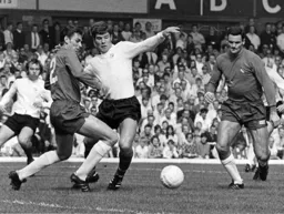 Malcolm Macdonald tussles with future Hatter Bobby A Thomson