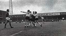 The players surround the referee after the disallowed goal