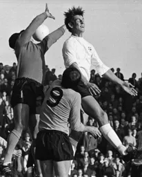 Chris Nicholl makes a nuisance of himself as he goes up for a Town attack