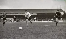 Viv Busby chases the ball