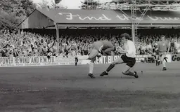 Peter Anderson tackles the keeper