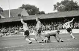 Don Givens celebrates scoring the first goal of the match