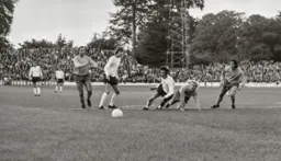 Don Givens tumbles in the box