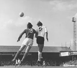 Chris Nicholl heads clear