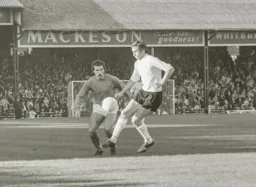 Mike Keen challenging the Carlisle midfield