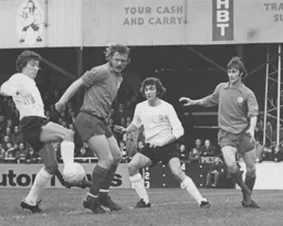 Vic Halom is frustrated by the Cardiff rearguard. Peter Anderson waits for scraps