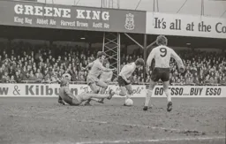 Peter Anderson attempts to round the keeper