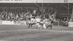 Viv Busby slides in but the ball goes wide