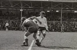 Vic Halom pressures the Portsmouth defence