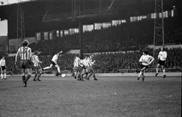 John Aston shoots for goal