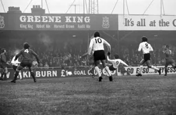Barry Butlin off the ground gets his shot away