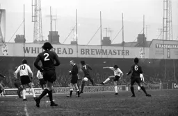 John Ryan looks to take out the Referee