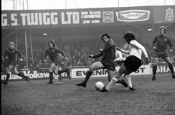 Peter Anderson still gets a cross in despite the close attention of the Orient defenders