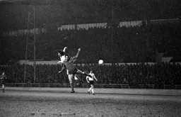 Barry Butlin leaps with the Forest defender