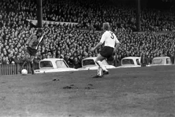 Alan Slough controls the ball despite the camber on the pitch