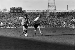 Jim Ryan moves past the defender