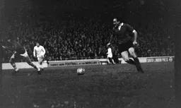 John Aston rounds the keeper to score